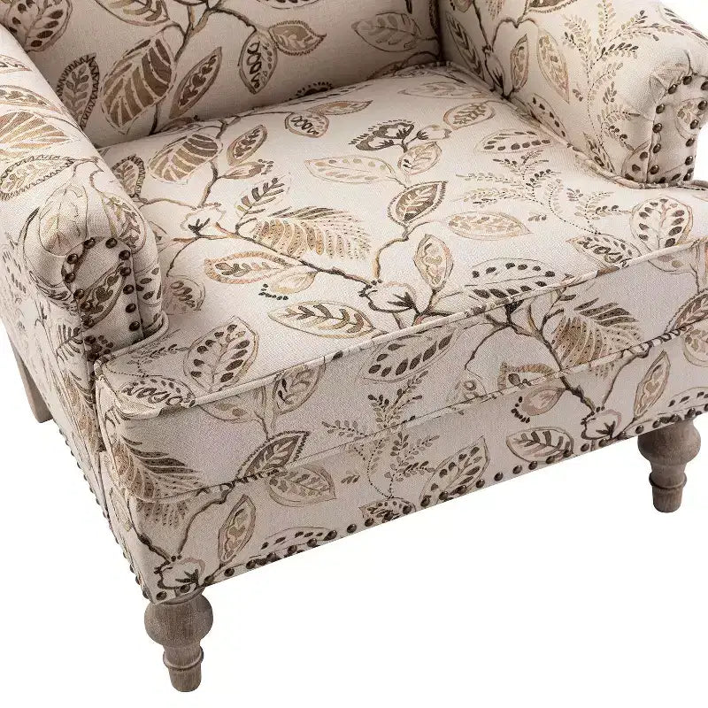 Fauteuil à accoudoirs pleins et dossier en forme de bosse de chameau Yahweh en bois de transition, avec garniture en tissu à motifs floraux | ART OF LIVING DES