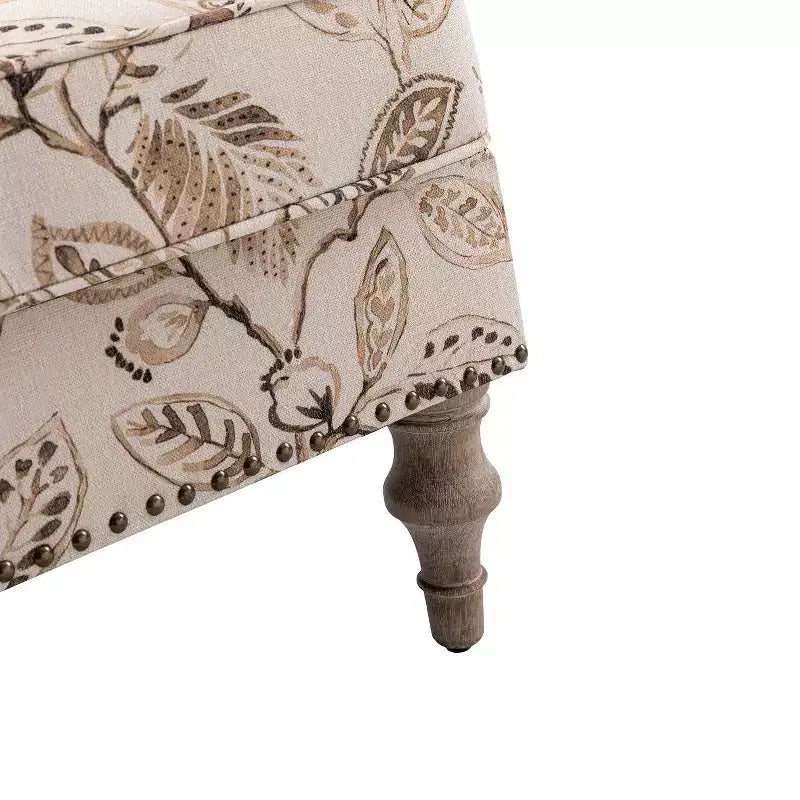 Fauteuil à accoudoirs pleins et dossier en forme de bosse de chameau Yahweh en bois de transition, avec garniture en tissu à motifs floraux | ART OF LIVING DES