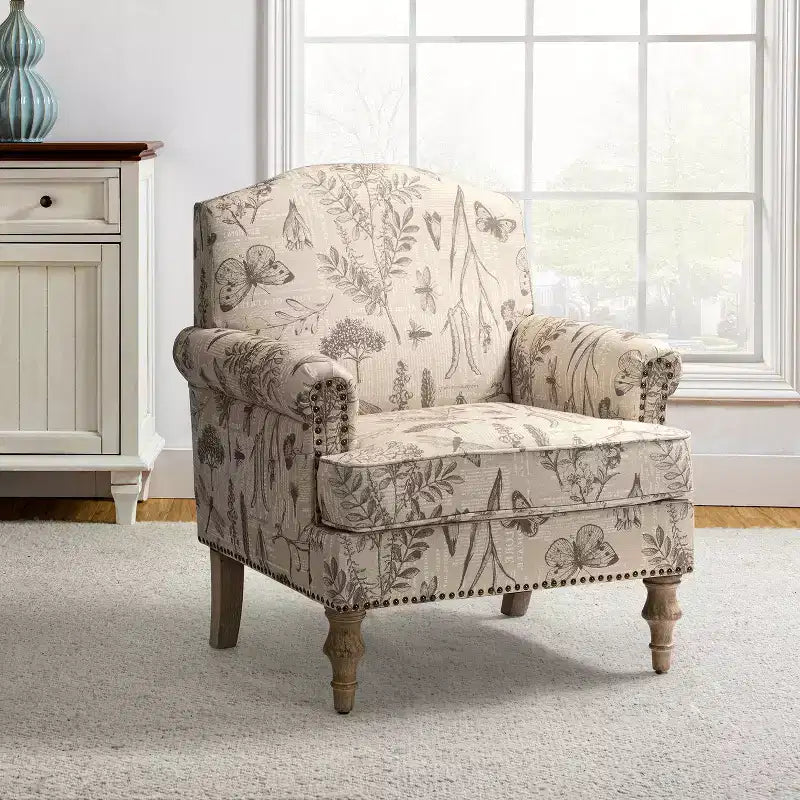 Fauteuil à accoudoirs pleins et dossier en forme de bosse de chameau Yahweh en bois de transition, avec garniture en tissu à motifs floraux | ART OF LIVING DES