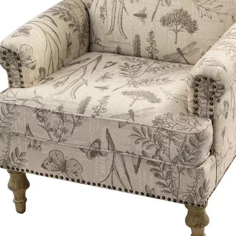 Fauteuil à accoudoirs pleins et dossier en forme de bosse de chameau Yahweh en bois de transition, avec garniture en tissu à motifs floraux | ART OF LIVING DES