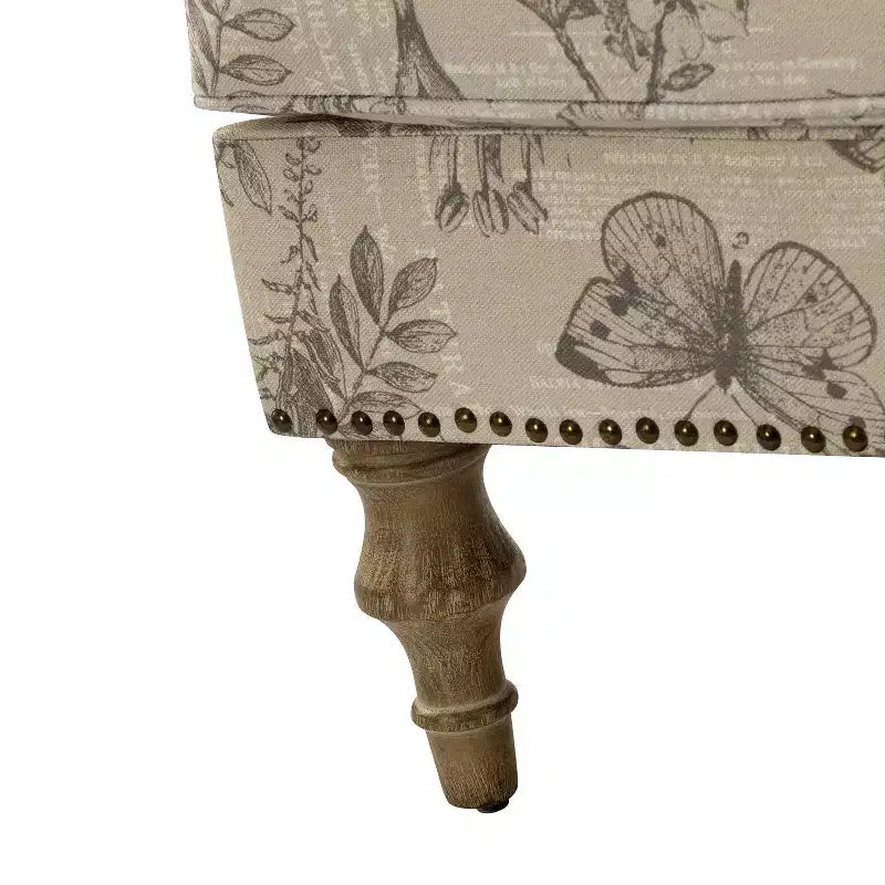 Fauteuil à accoudoirs pleins et dossier en forme de bosse de chameau Yahweh en bois de transition, avec garniture en tissu à motifs floraux | ART OF LIVING DES