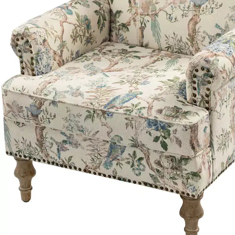 Fauteuil à accoudoirs pleins et dossier en forme de bosse de chameau Yahweh en bois de transition, avec garniture en tissu à motifs floraux | ART OF LIVING DES