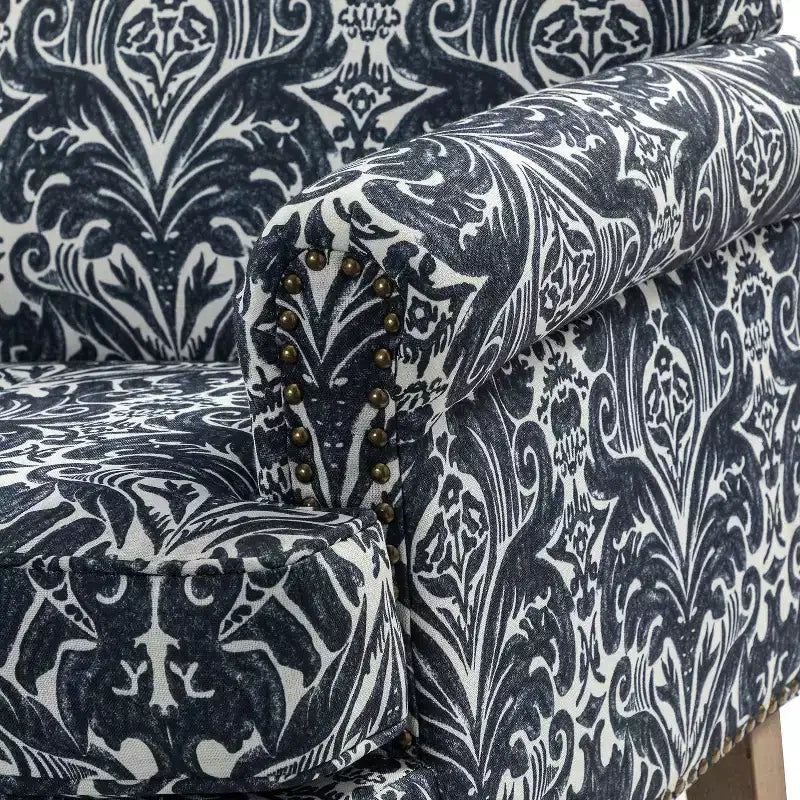 Fauteuil à accoudoirs pleins et dossier en forme de bosse de chameau Yahweh en bois de transition, avec garniture en tissu à motifs floraux | ART OF LIVING DES