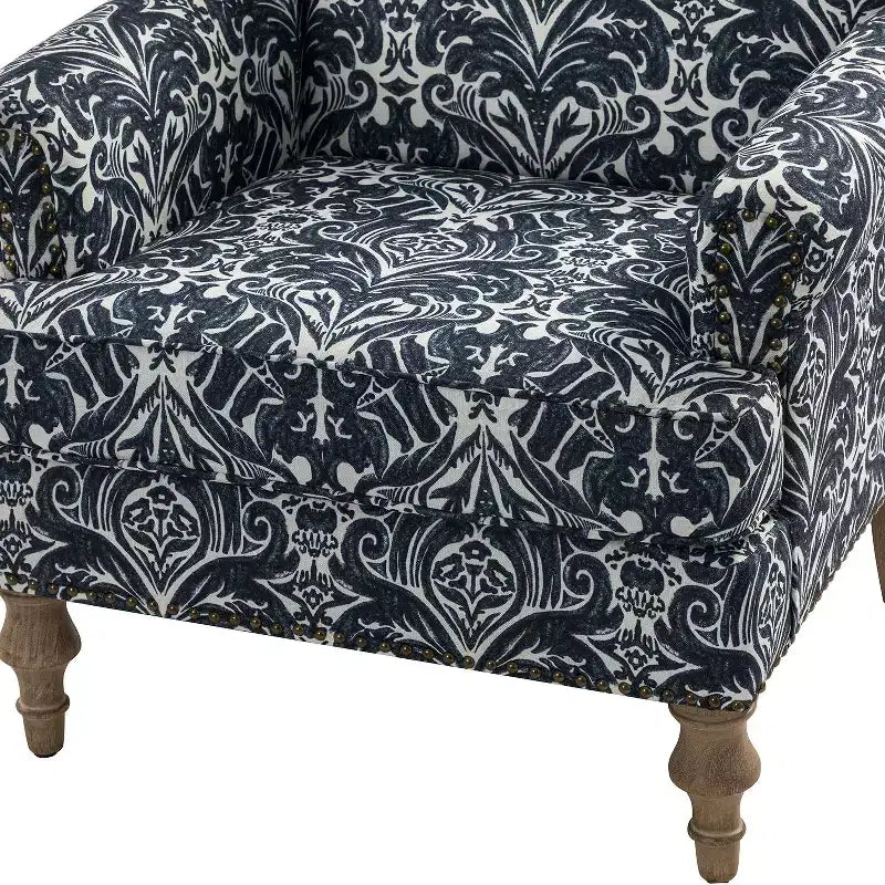 Fauteuil à accoudoirs pleins et dossier en forme de bosse de chameau Yahweh en bois de transition, avec garniture en tissu à motifs floraux | ART OF LIVING DES