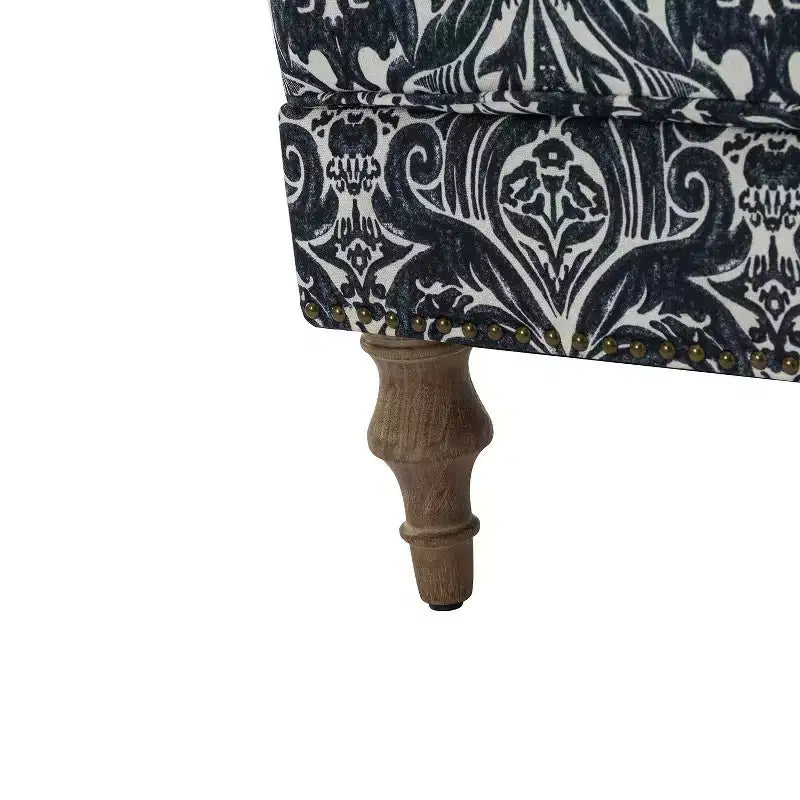 Fauteuil à accoudoirs pleins et dossier en forme de bosse de chameau Yahweh en bois de transition, avec garniture en tissu à motifs floraux | ART OF LIVING DES