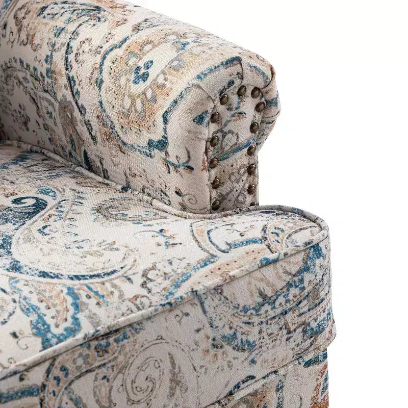 Fauteuil à accoudoirs pleins et dossier en forme de bosse de chameau Yahweh en bois de transition, avec garniture en tissu à motifs floraux | ART OF LIVING DES