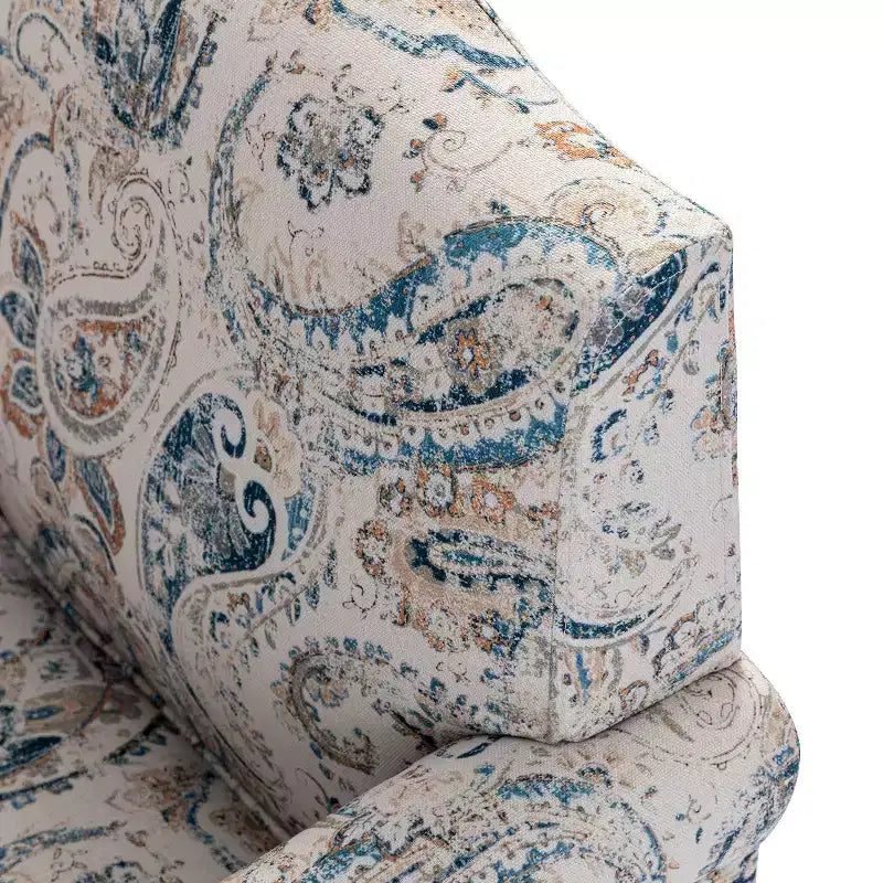 Fauteuil à accoudoirs pleins et dossier en forme de bosse de chameau Yahweh en bois de transition, avec garniture en tissu à motifs floraux | ART OF LIVING DES