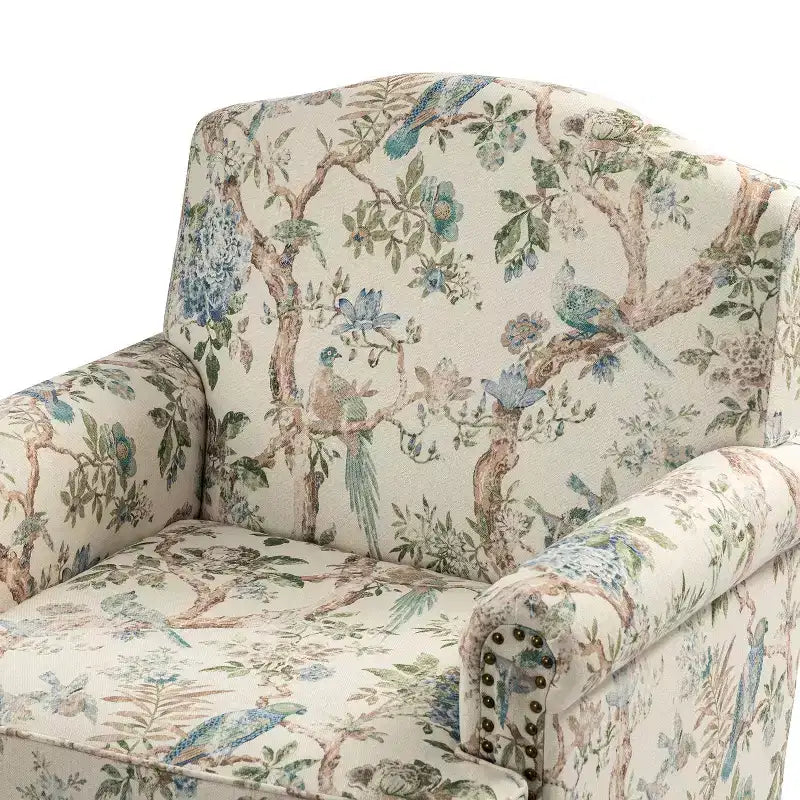 Fauteuil à accoudoirs pleins et dossier en forme de bosse de chameau Yahweh en bois de transition, avec garniture en tissu à motifs floraux | ART OF LIVING DES