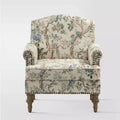 Fauteuil à accoudoirs pleins et dossier en forme de bosse de chameau Yahweh en bois de transition, avec garniture en tissu à motifs floraux | ART OF LIVING DES