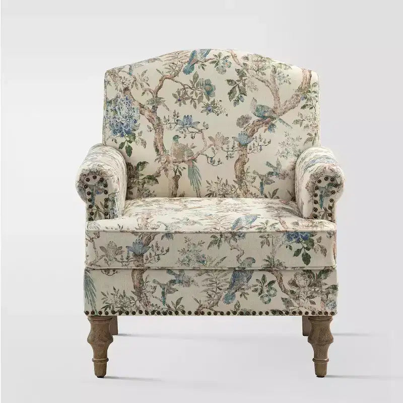 Fauteuil à accoudoirs pleins et dossier en forme de bosse de chameau Yahweh en bois de transition, avec garniture en tissu à motifs floraux | ART OF LIVING DES