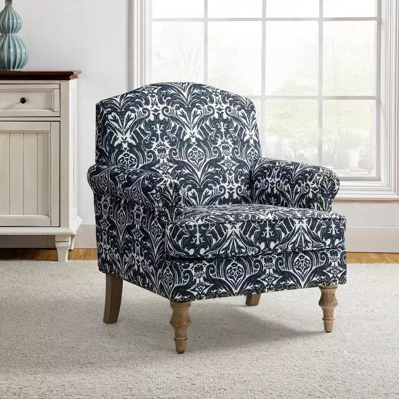 Fauteuil à accoudoirs pleins et dossier en forme de bosse de chameau Yahweh en bois de transition, avec garniture en tissu à motifs floraux | ART OF LIVING DES