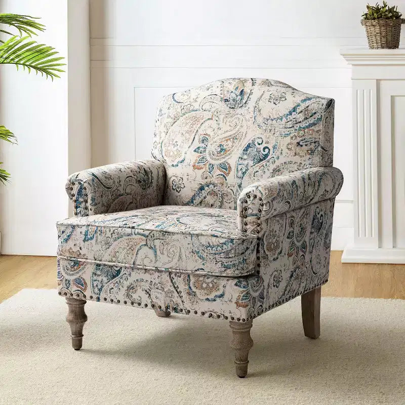 Fauteuil à accoudoirs pleins et dossier en forme de bosse de chameau Yahweh en bois de transition, avec garniture en tissu à motifs floraux | ART OF LIVING DES